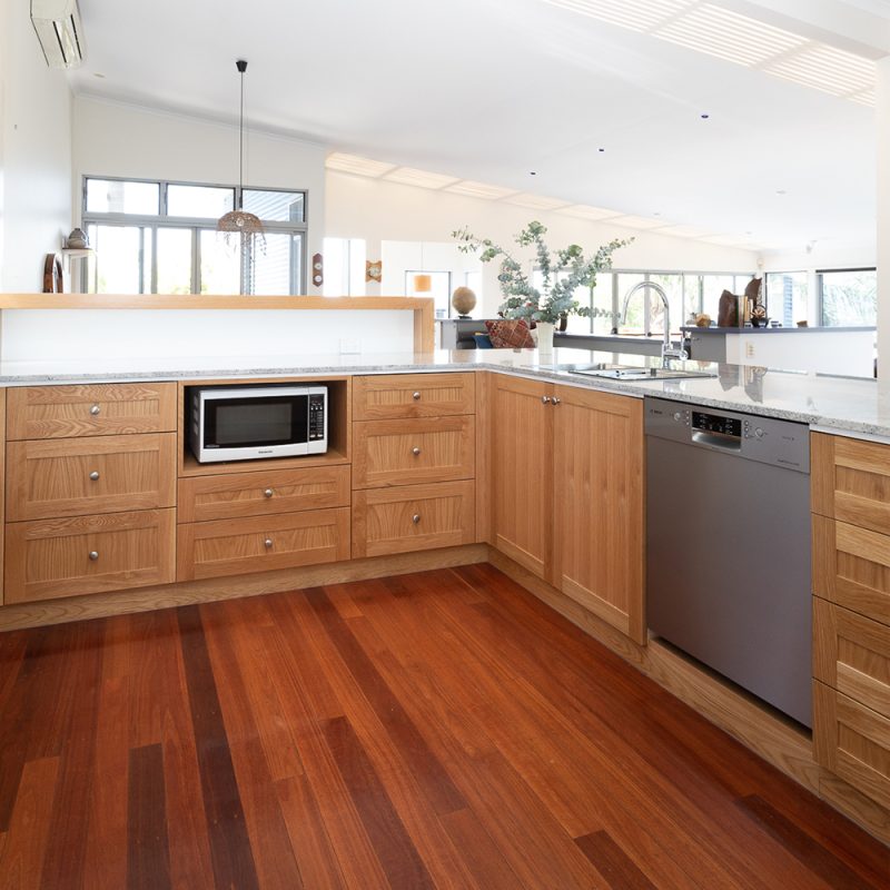 American Oak Timber Kitchen featuring 3 Panelling and framed cabinet door fronts and a feature timber benchtop by Buywood Furniture.