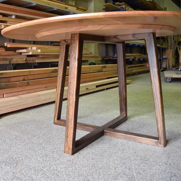 The Darling round wooden dining table possesses a beautiful contemporary design with geometric timber legs custom made by Buywood Furniture, Brisbane, AU.