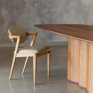 The Kai Dining Chair is a Danish design classic hand-crafted from your preferred solid hardwood timber with an upholstered seat and back for your comfort.