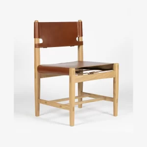 Custom designed and crafted by Buywood Furniture, the Kimberley Dining Chair is fitted with belt straps as a unique design feature.
