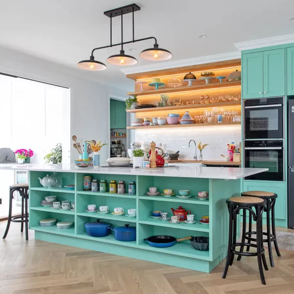 This farmhouse timber kitchen is ergonomically designed for convenience and family living. Solid wood doors painted in a very trendy pastel mint green by Buywood Furniture.