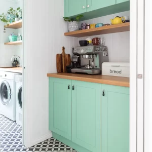 This farmhouse timber kitchen is ergonomically designed for convenience and family living. Solid wood doors painted in a very trendy pastel mint green by Buywood Furniture.