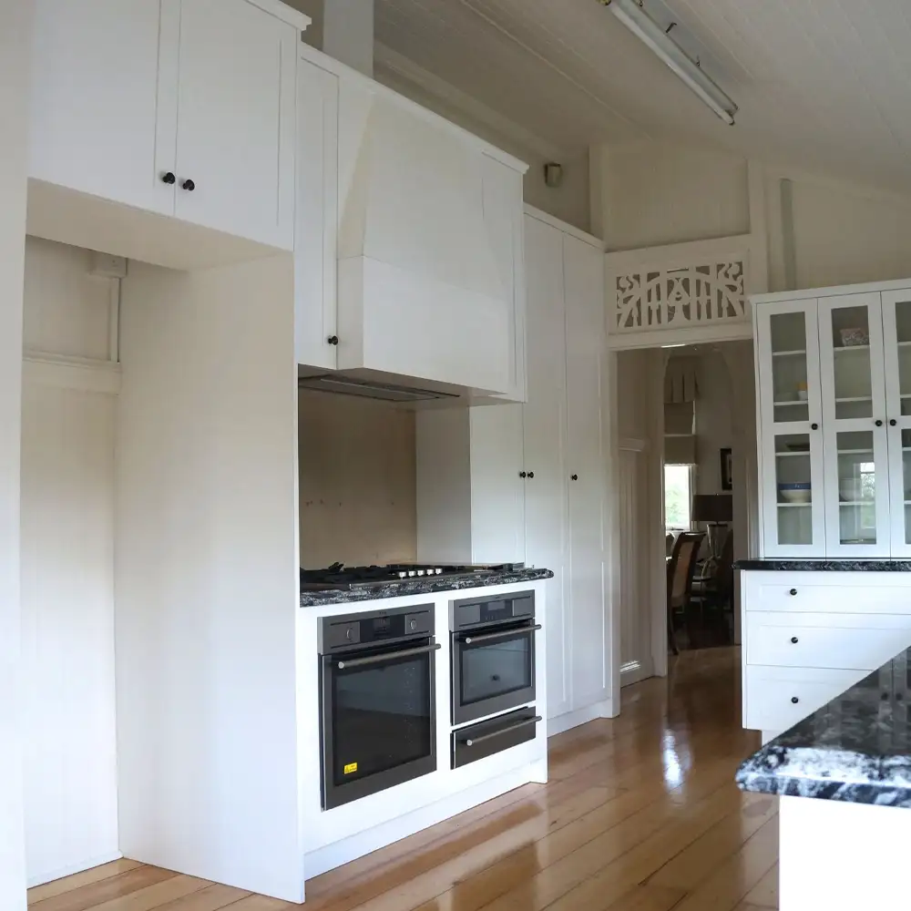 Hamptons Style kitchen installation, in solid timber, American Oak and stunning granite bench tops was custom designed and made by Buywood Furniture, Brisbane.