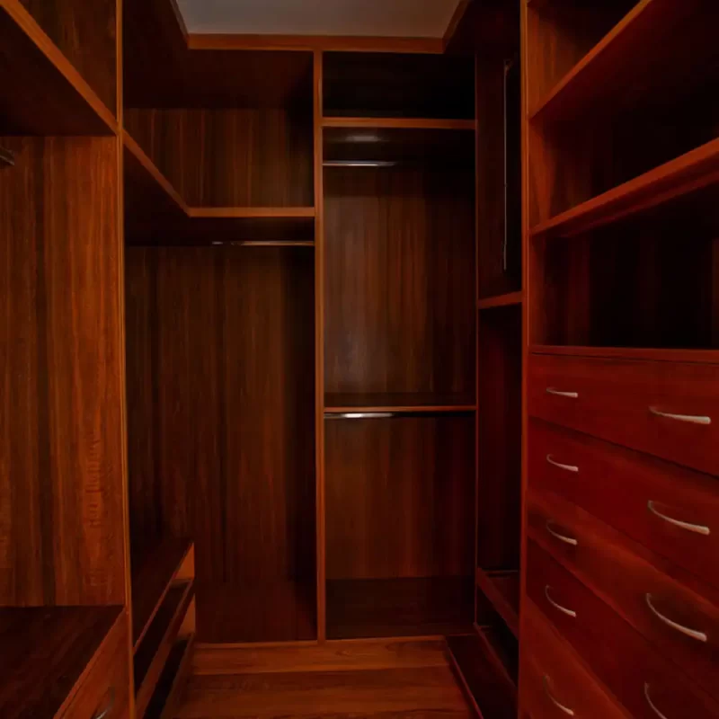 Solid timber walk in wardrobe custom designed and made by Buywood Furniture from durable solid timber using time honored joinery skills.