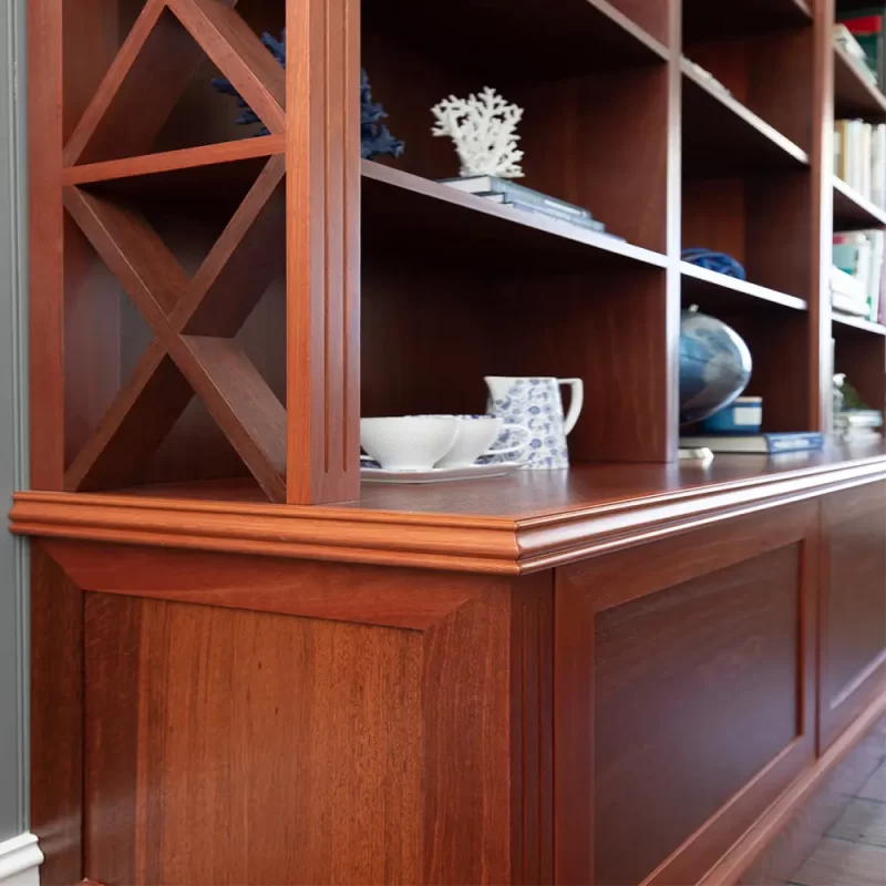 The Burbank Bookshelf Cabinet custom designed by Buywood Furniture features eye catching cross detailing down the sides of the shelves with traditional French colonial fluting.