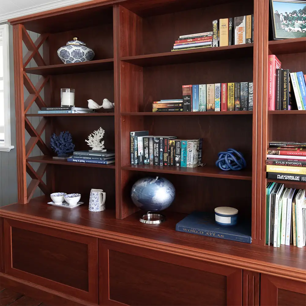 The Burbank Bookshelf Cabinet custom designed by Buywood Furniture features eye catching cross detailing down the sides of the shelves with traditional French colonial fluting.