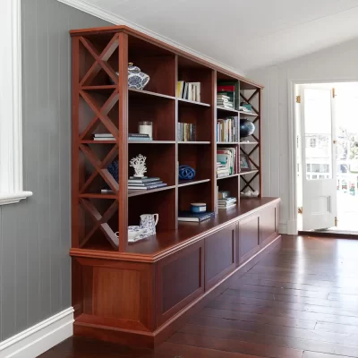 The Burbank Bookshelf Cabinet custom designed by Buywood Furniture features eye catching cross detailing down the sides of the shelves with traditional French colonial fluting.