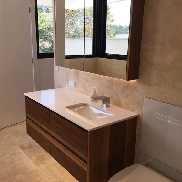 Custom designed, crafted and installed bathroom vanity using your choice of wood by Buywood Furniture.