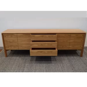 The Jensen sideboard is crafted from 100% solid wood. Complete with push release doors, functional internal shelving and three central dove tail joint drawers. Custom designed by Buywood Furniture, Brisbane.