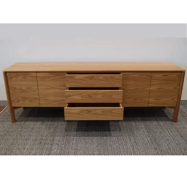 The Jensen sideboard is crafted from 100% solid wood. Complete with push release doors, functional internal shelving and three central dove tail joint drawers. Custom designed by Buywood Furniture, Brisbane.