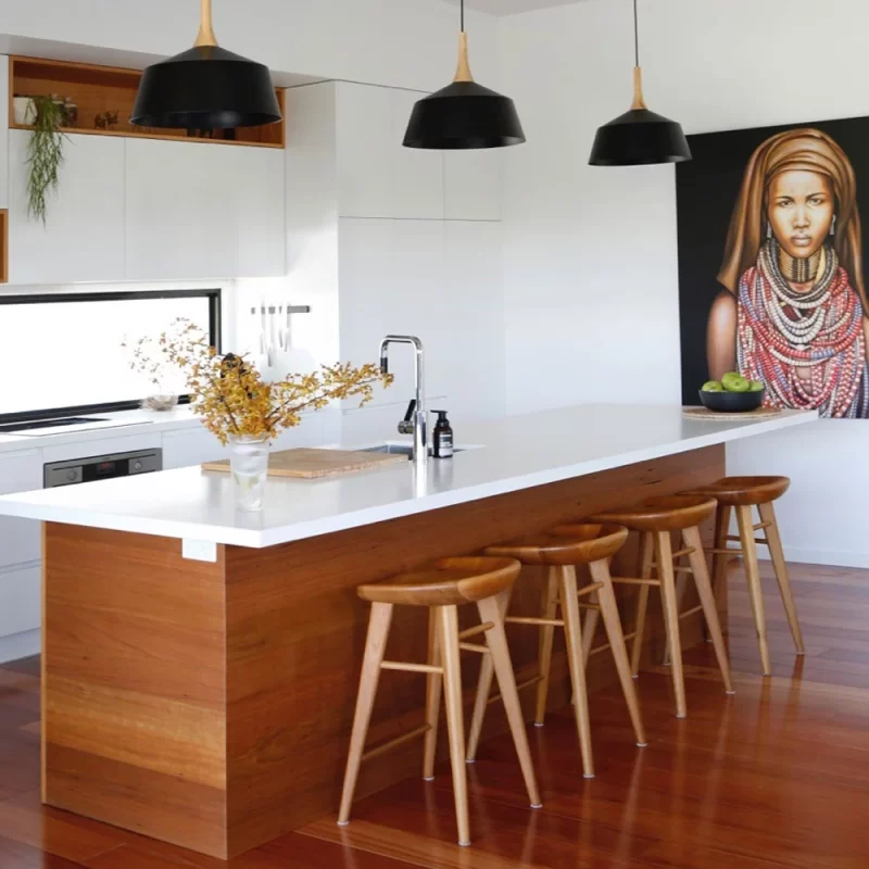 The timber surround of this kitchen benchtop was custom built by Buywood Furniture and series of alcoves was built from Blackbutt timber.