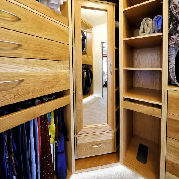 Custom walk in wardrobe fitted with classic dovetail drawers and top quality gadgets and mechanisms can be custom designed to suit your storage needs and fit into any home.