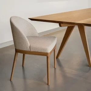 The Noella custom designed chair in timber and fabric seat and back is crafted by Buywood Furniture joinery in Brisbane.