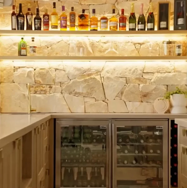 LED lighting to illuminate these floating shelves, Natural Sydney Sandstone and American Oak used in this beautiful kitchen.