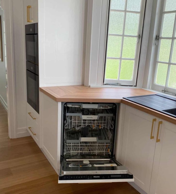 Integrated appliances for this custom designed luxe kitchen with integrated appliances, and Blackbutt timber benchtops by Brisbane joinery Buywood Furniture