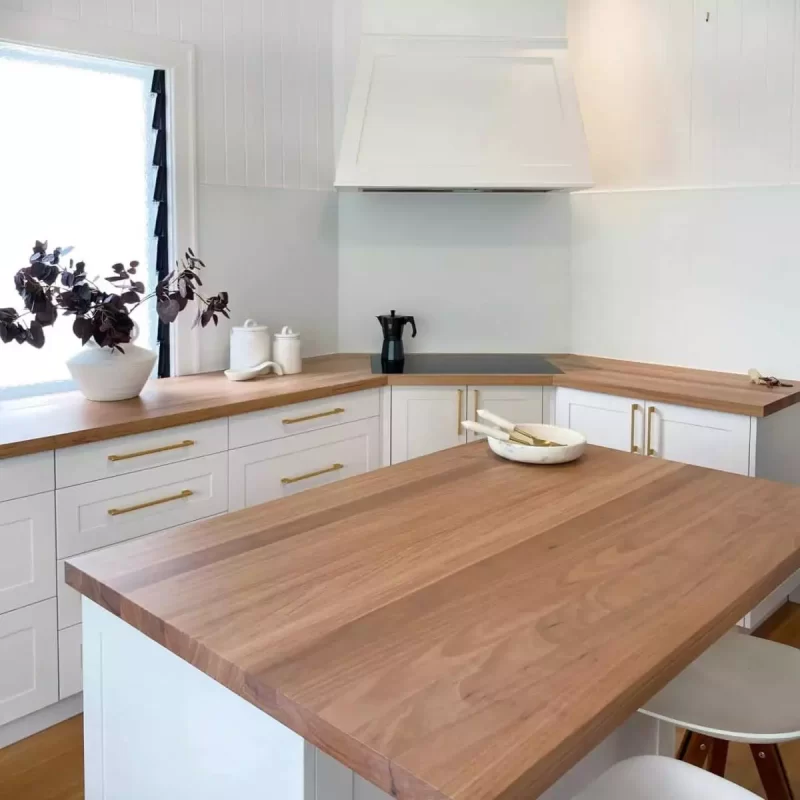 Blackbutt timber island benchtop for custom designed kitchen including dovetail drawers and integrated appliances by Buywood Furniture